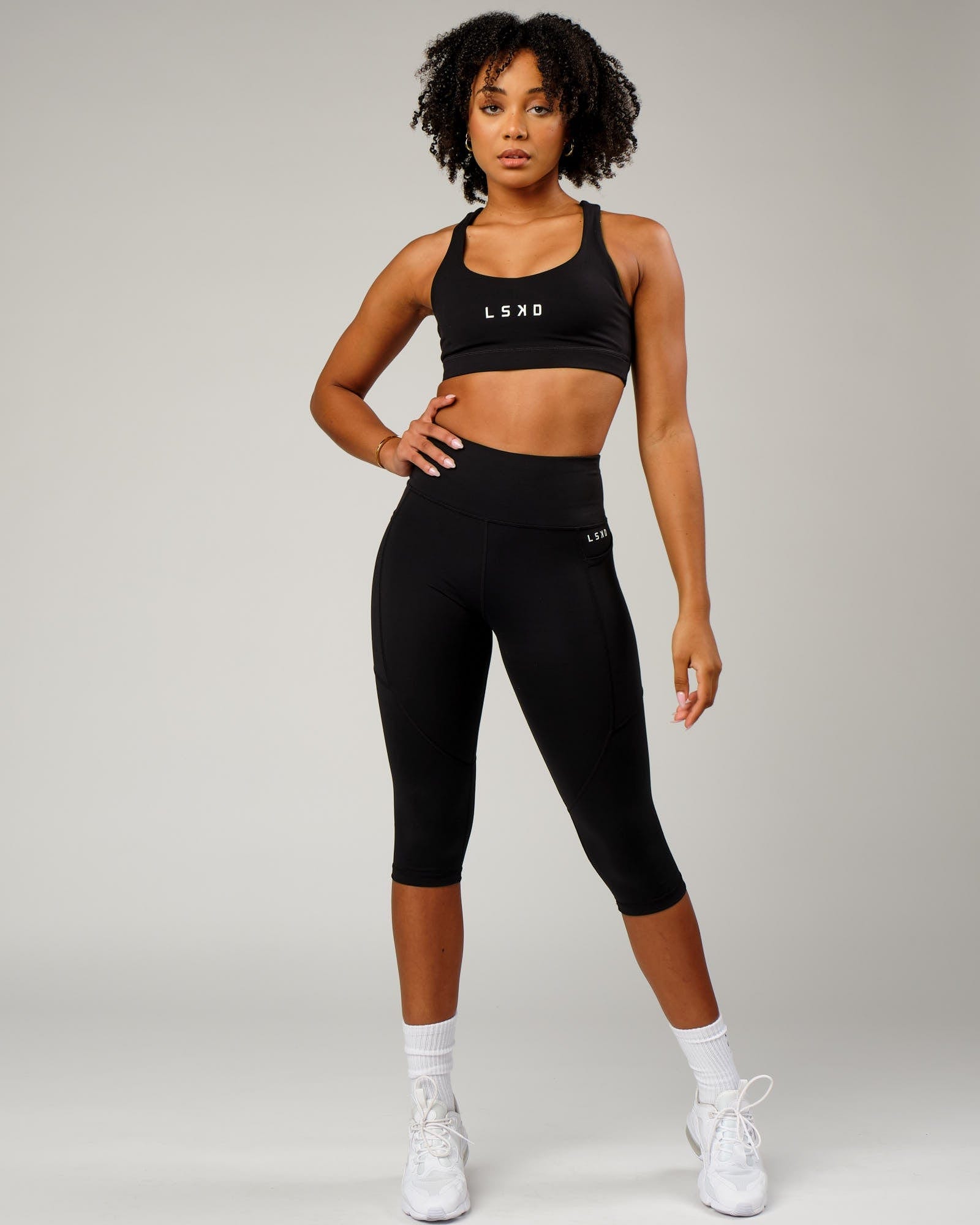 Model wearing Rep 3/4 Length Tight Small Logo - Black