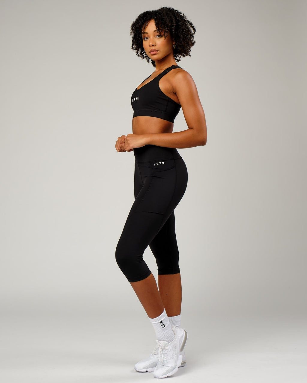 Model wearing Rep 3/4 Length Tight Small Logo - Black
