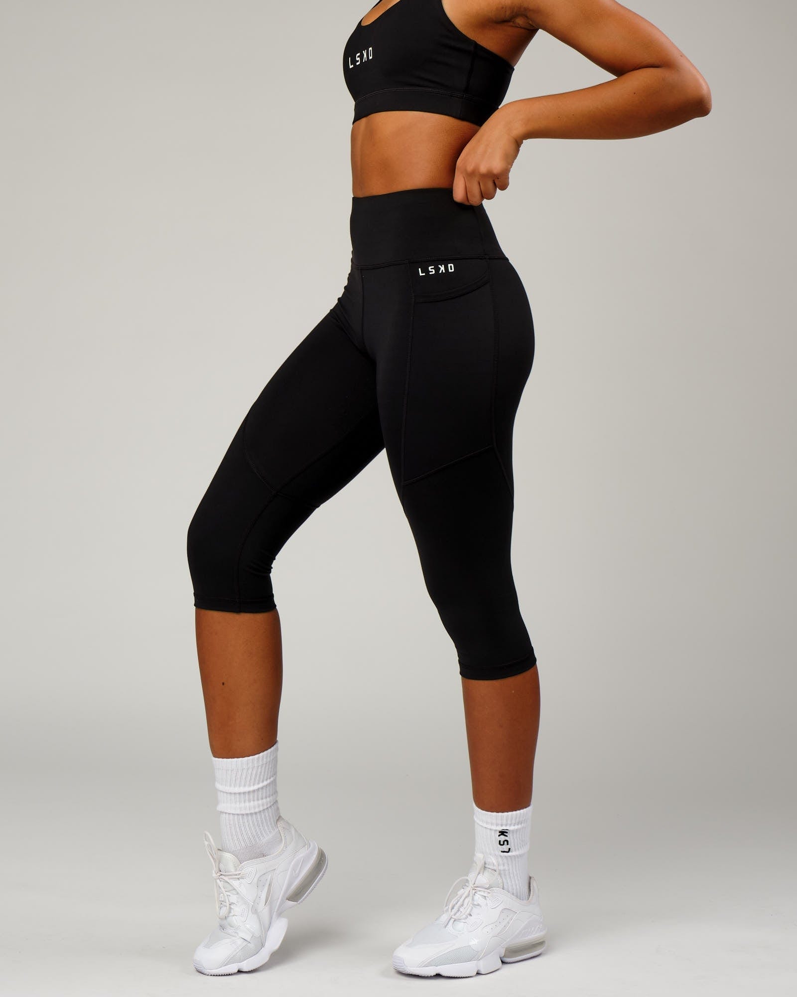 Model wearing Rep 3/4 Length Tight Small Logo - Black