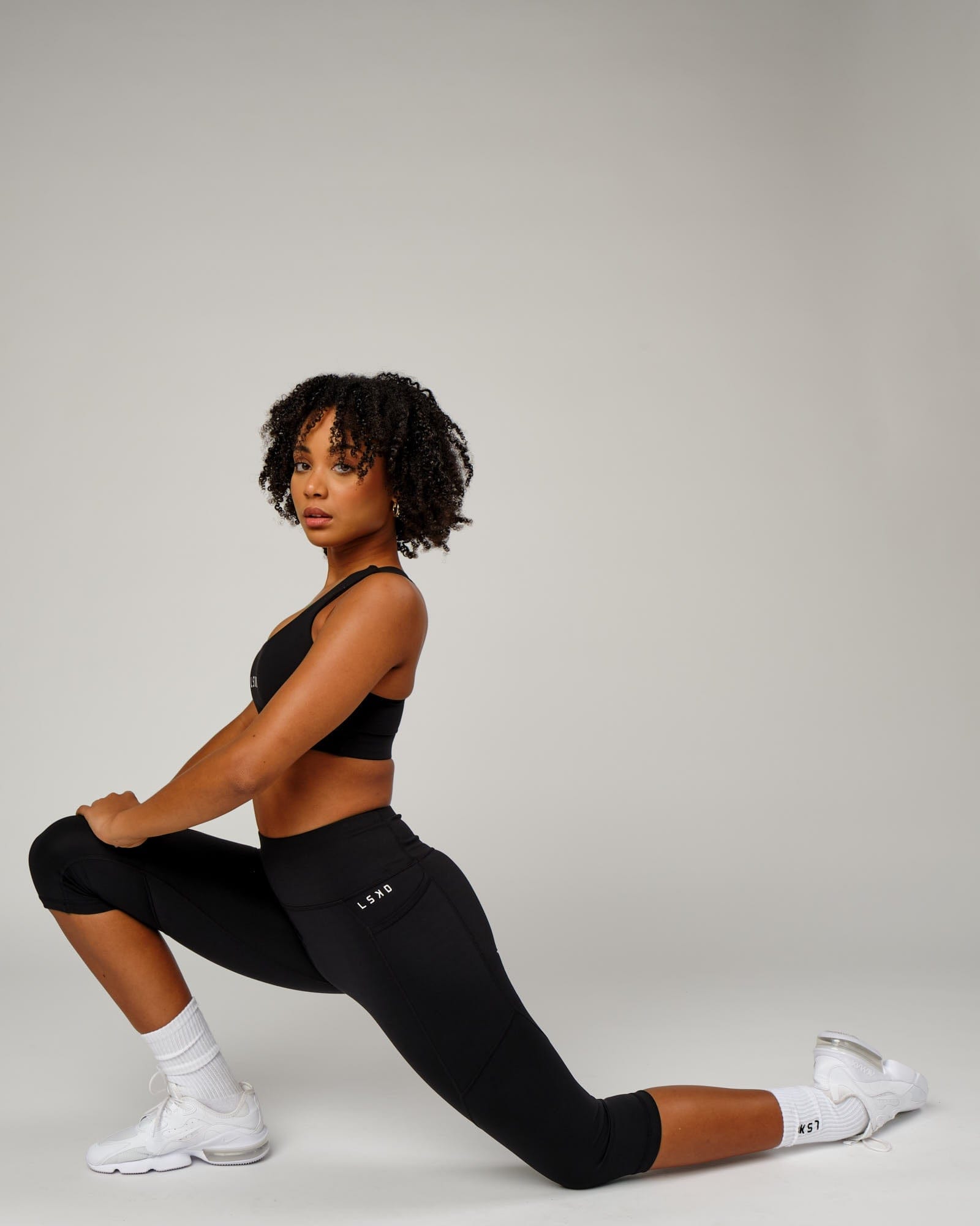 Model wearing Rep 3/4 Length Tight Small Logo - Black