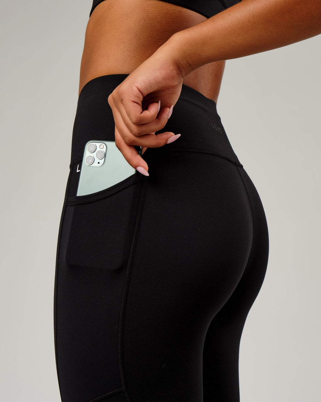 Model wearing Rep 7/8 Length Tight Small Logo - Black-White