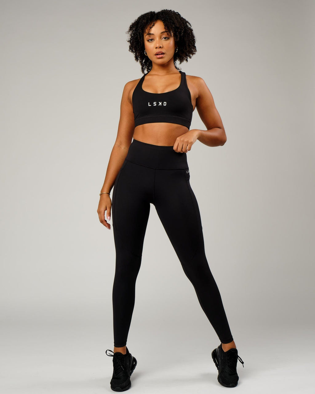 Model wearing Rep Full Length Tight Small Logo - Black-White