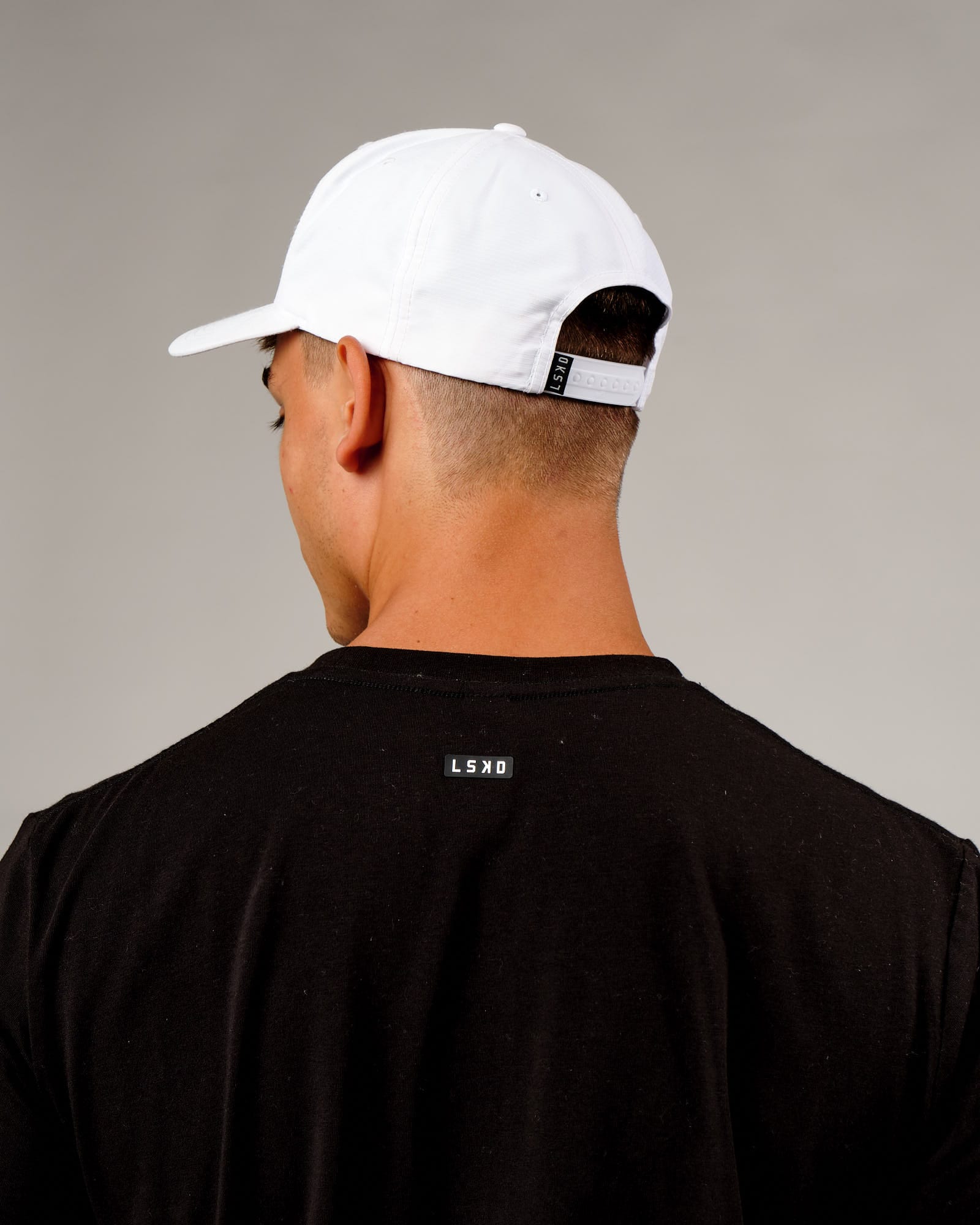 Model wearing Repel Cap - White