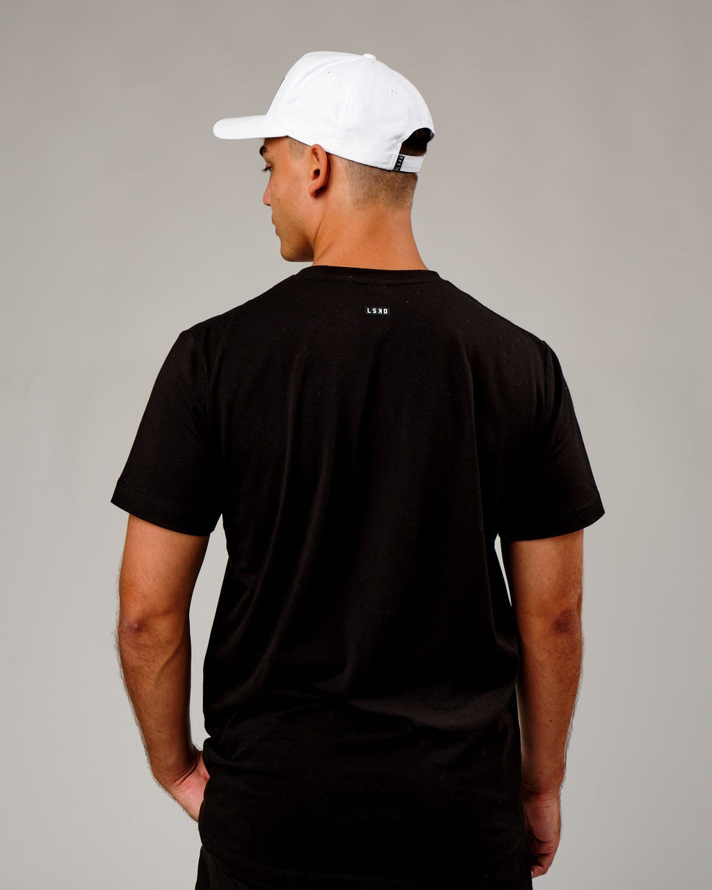 Model wearing Repel Cap - White