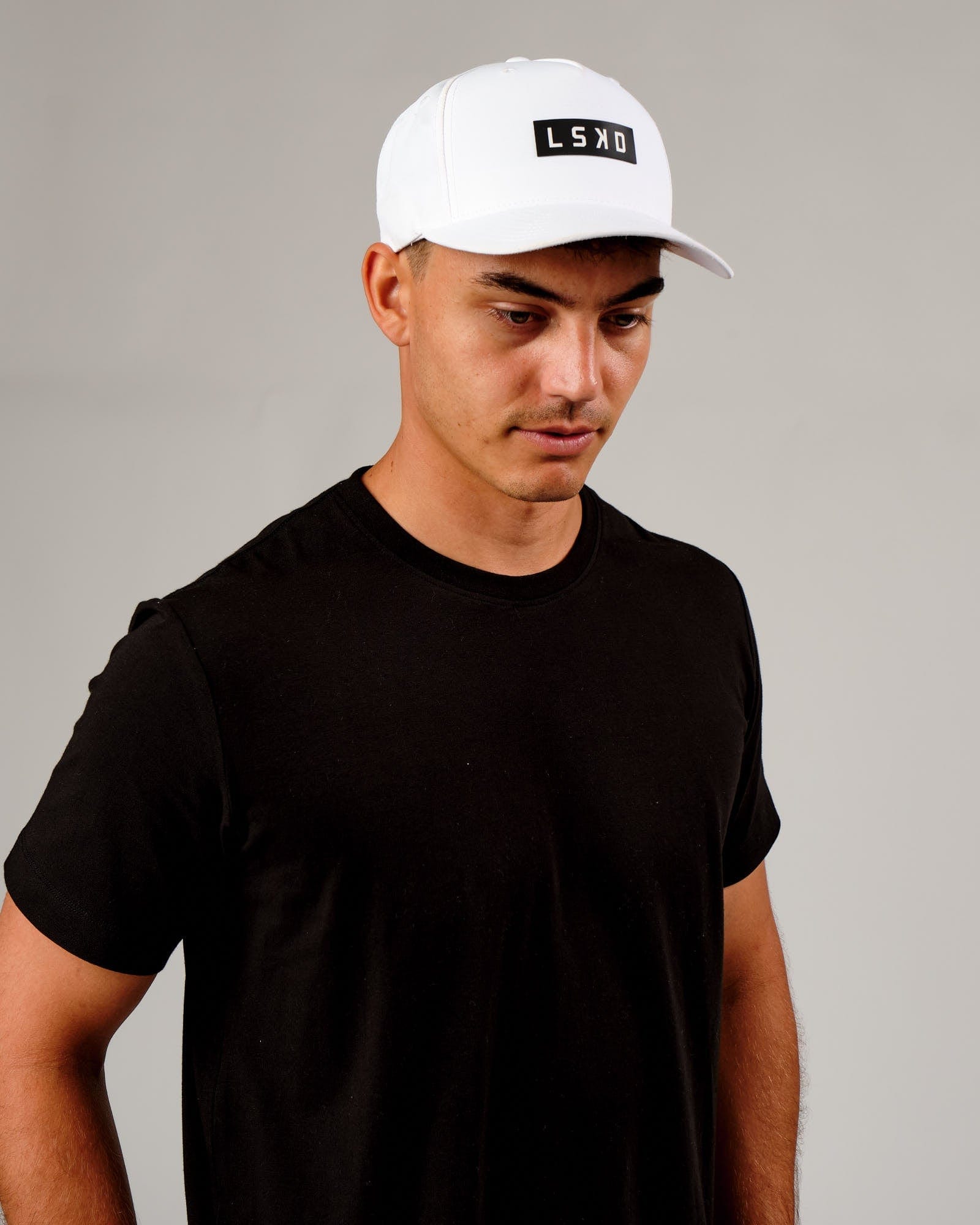 Model wearing Repel Cap - White
