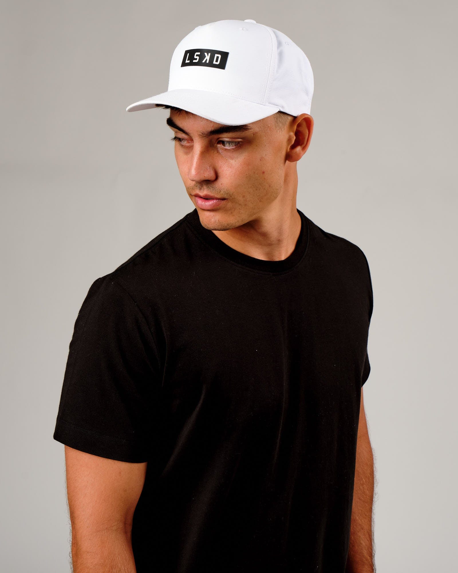 Model wearing Repel Cap - White