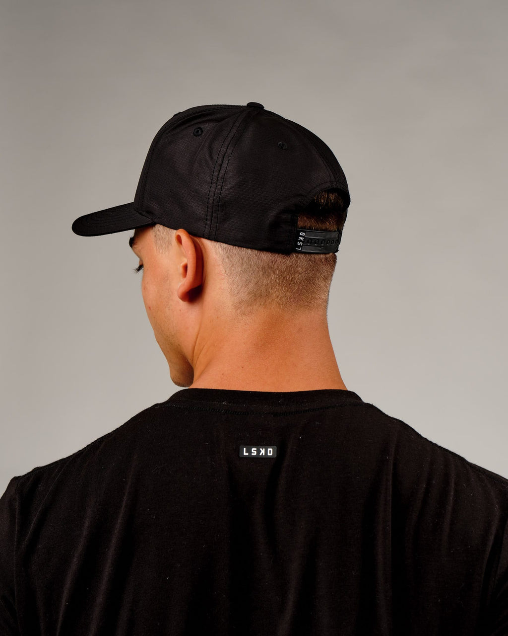 Model wearing Repel Cap - Black