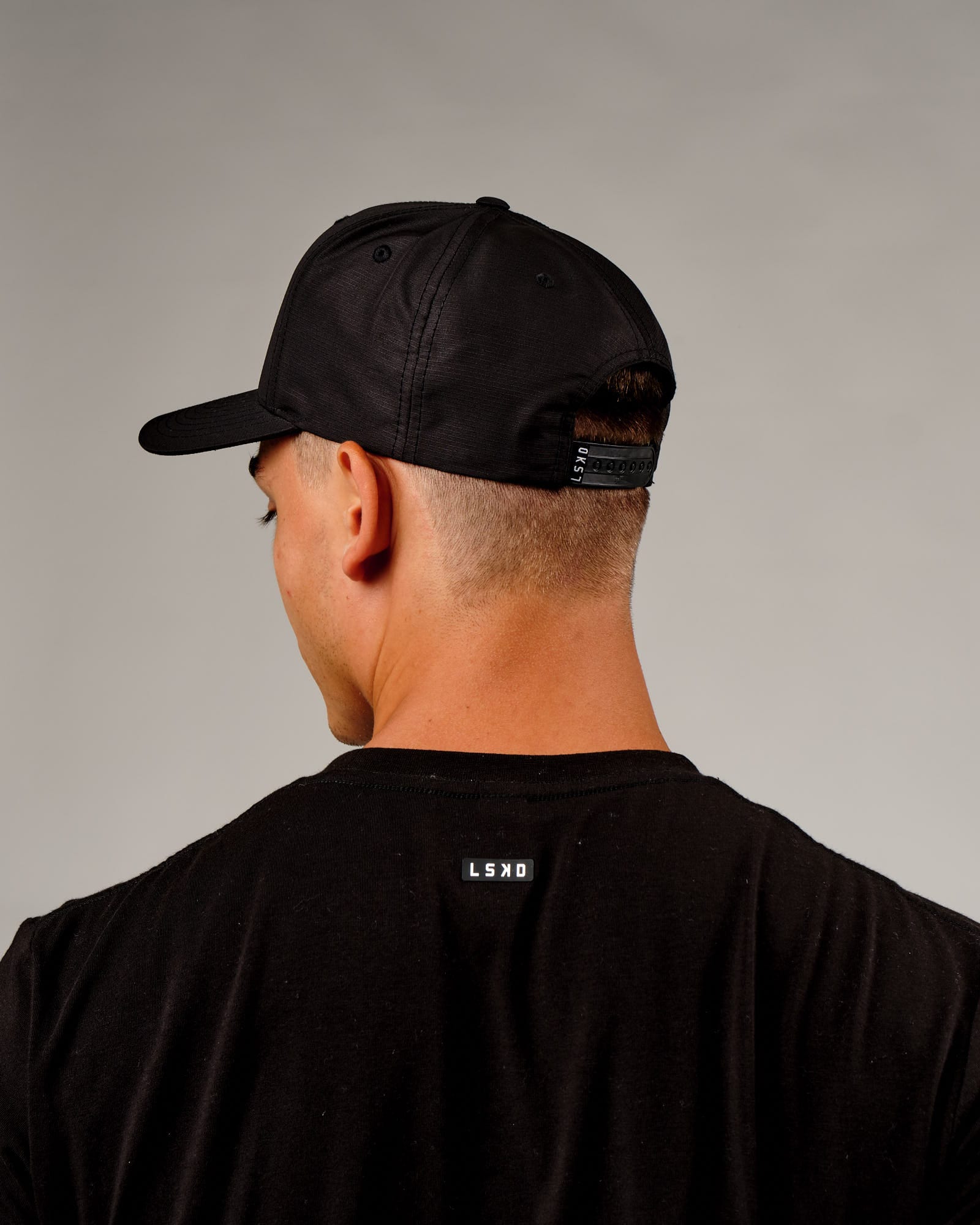 Model wearing Repel Cap - Black