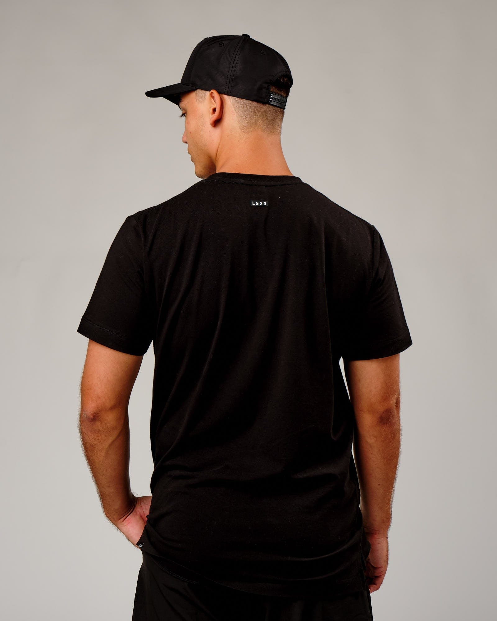Model wearing Repel Cap - Black