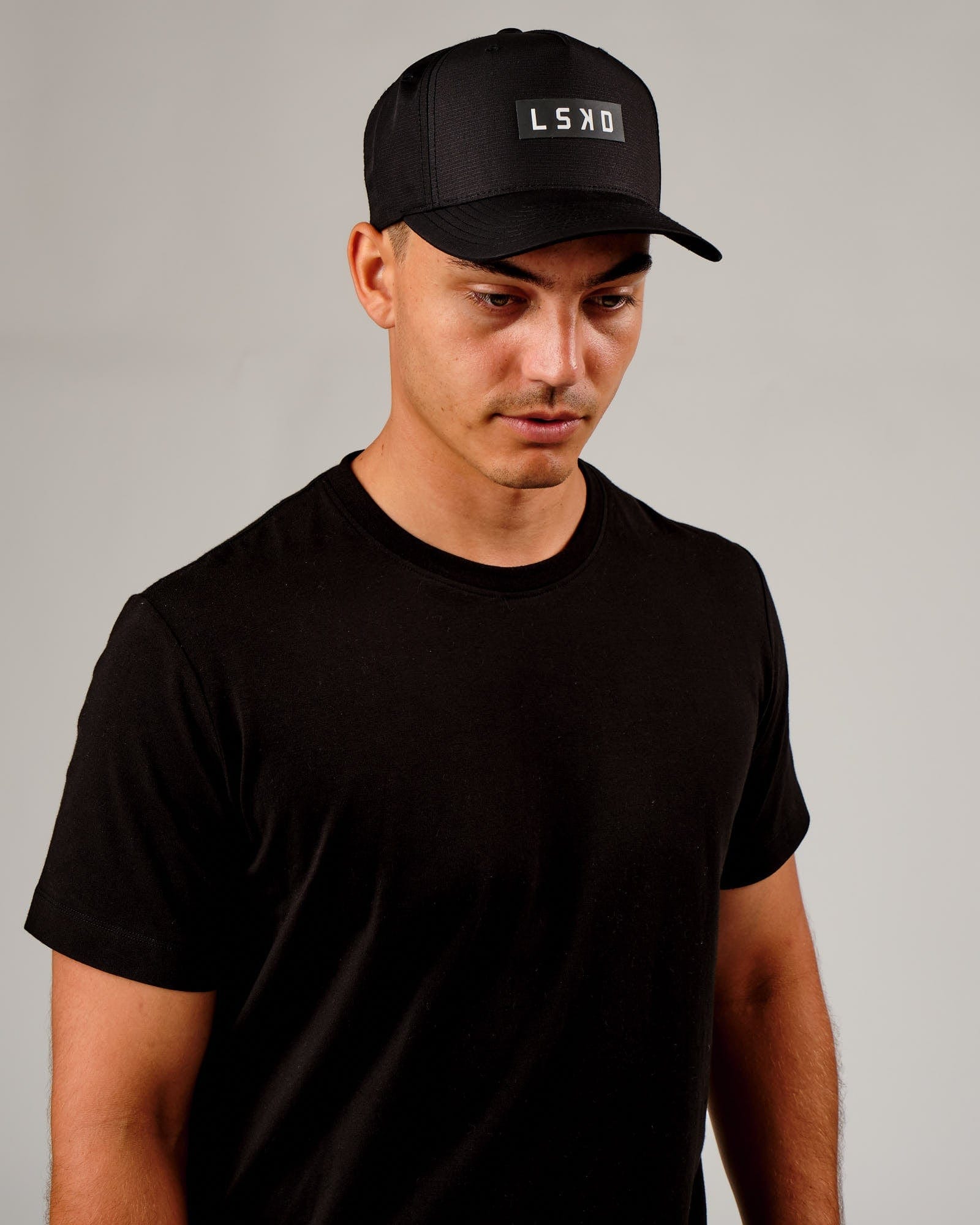 Model wearing Repel Cap - Black