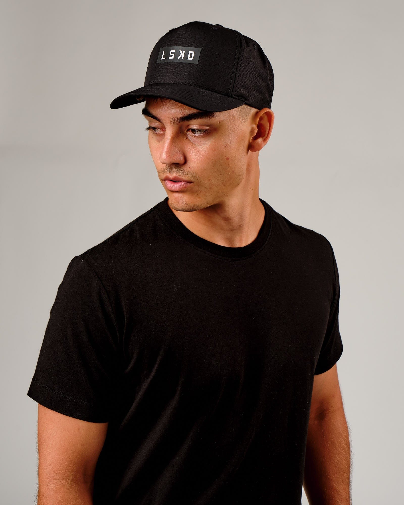 Model wearing Repel Cap - Black