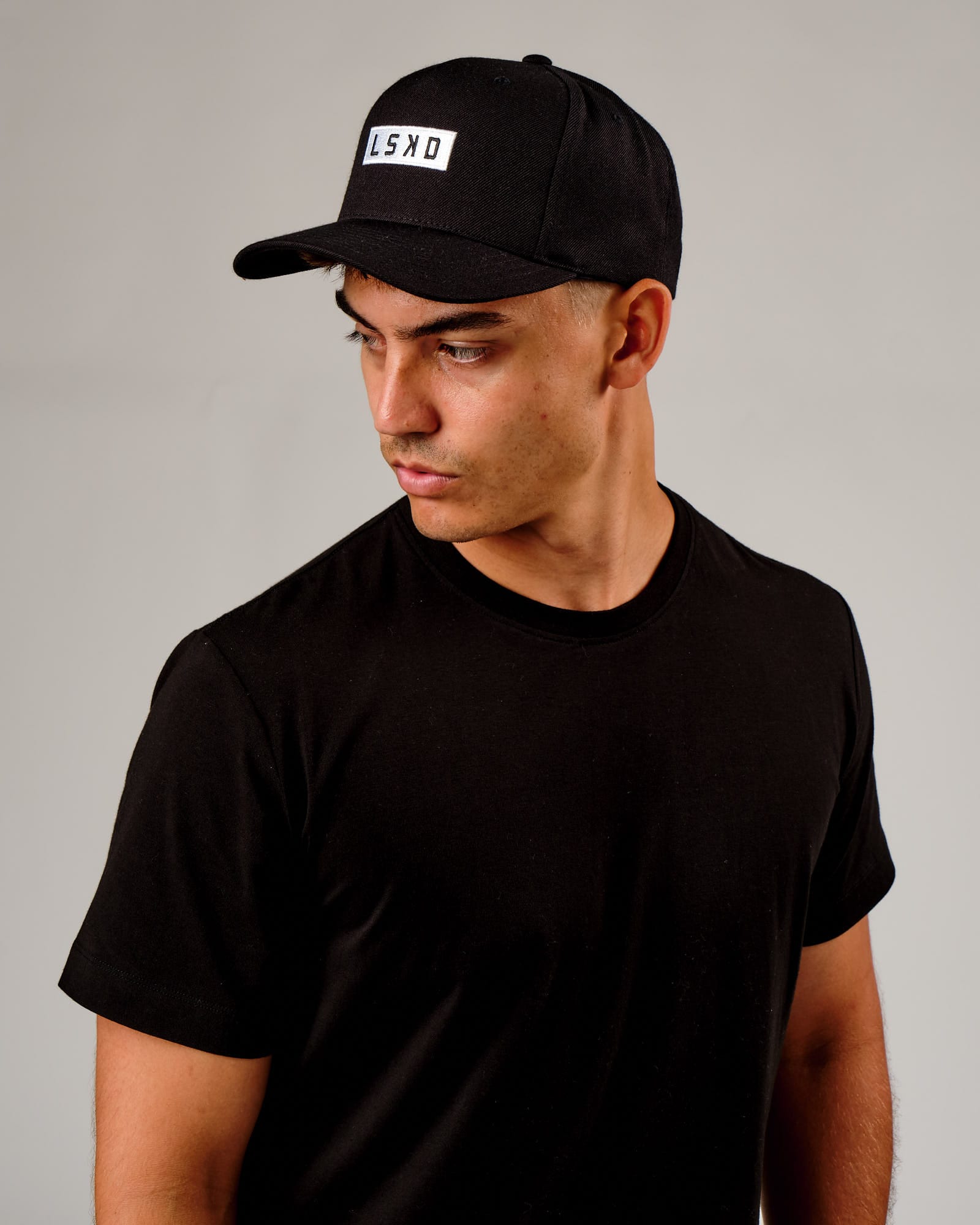 Model wearing Cornerstone Snapback Cap - Black-White