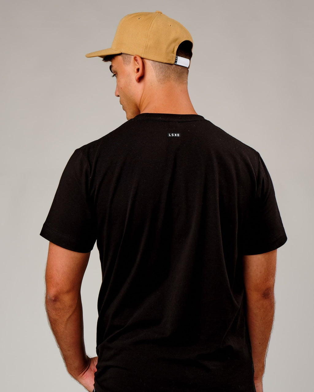 Model wearing Cornerstone Cap - Camel