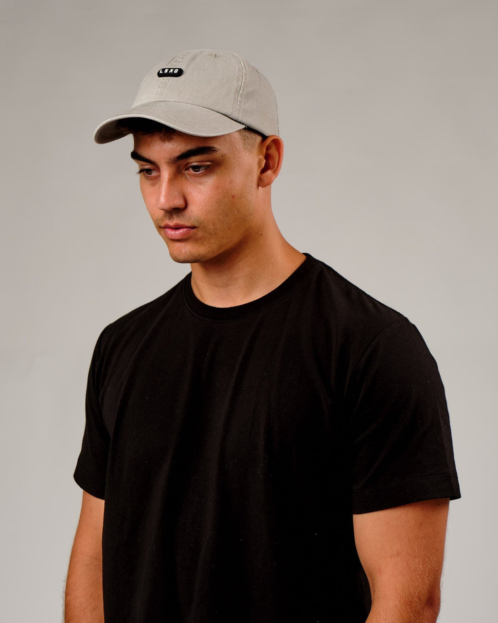 Model wearing Capsule Cap - Bone