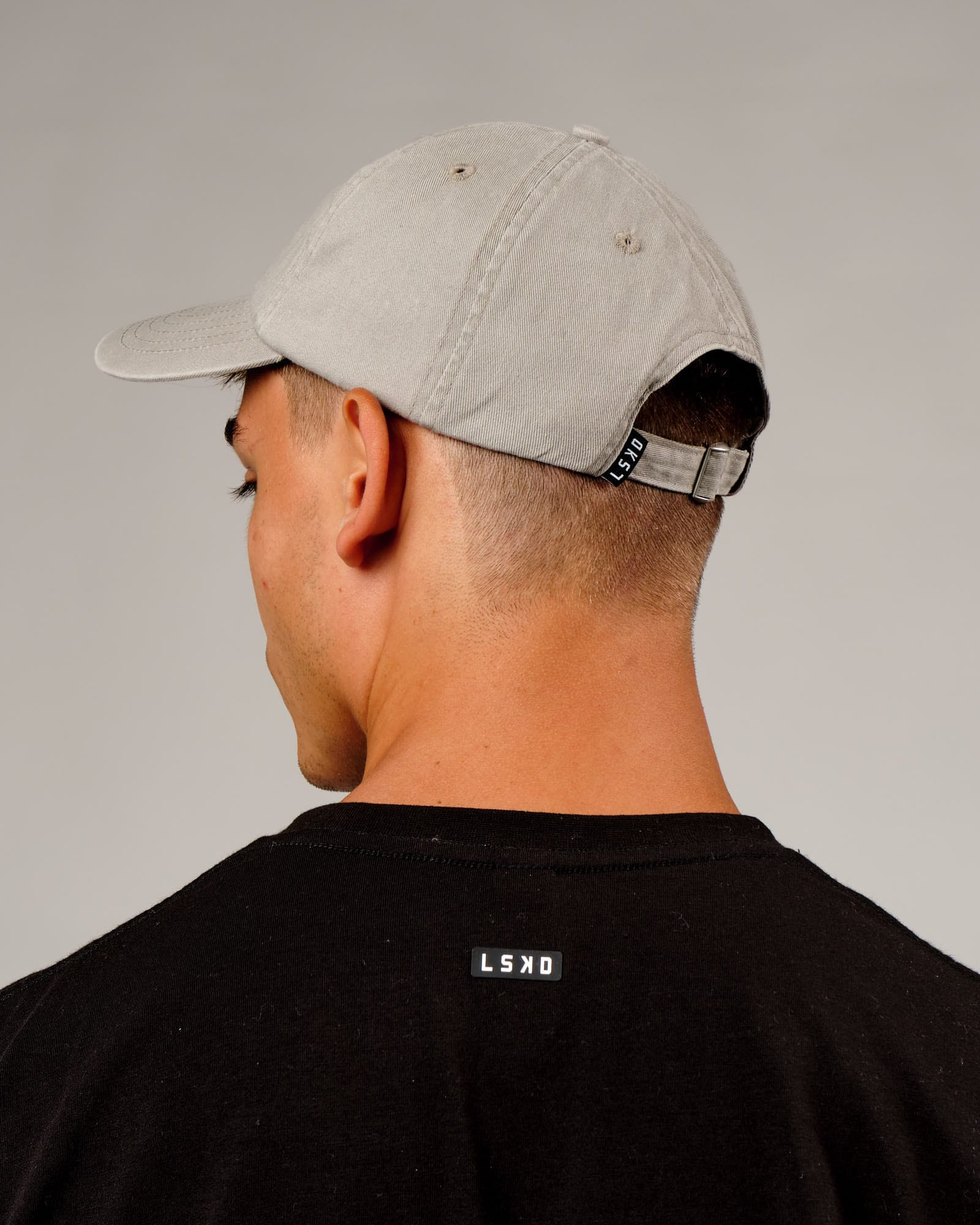 Model wearing Capsule Cap - Bone