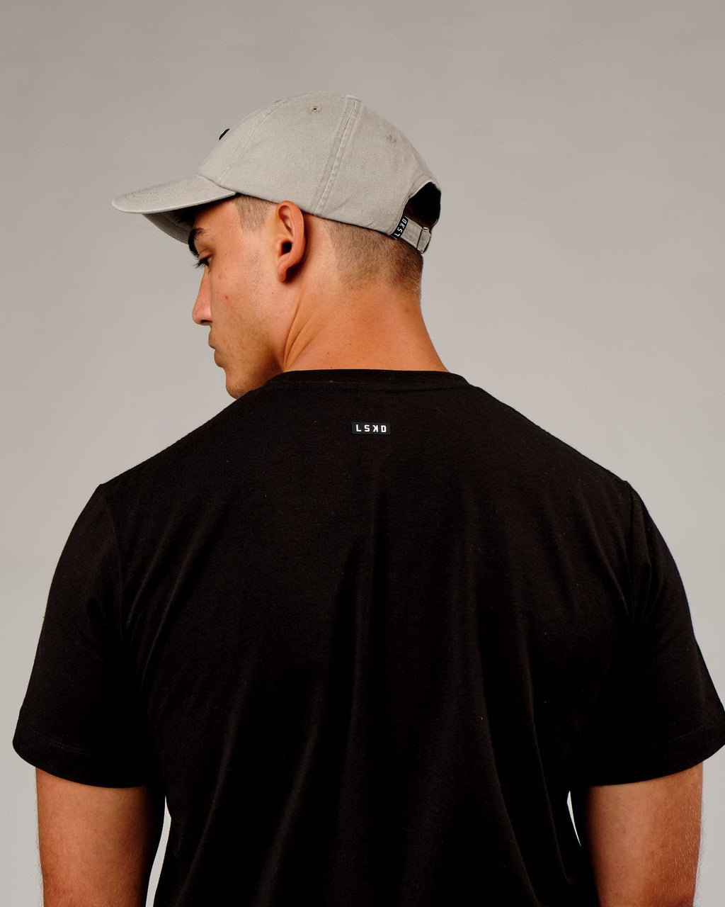 Model wearing Capsule Cap - Bone