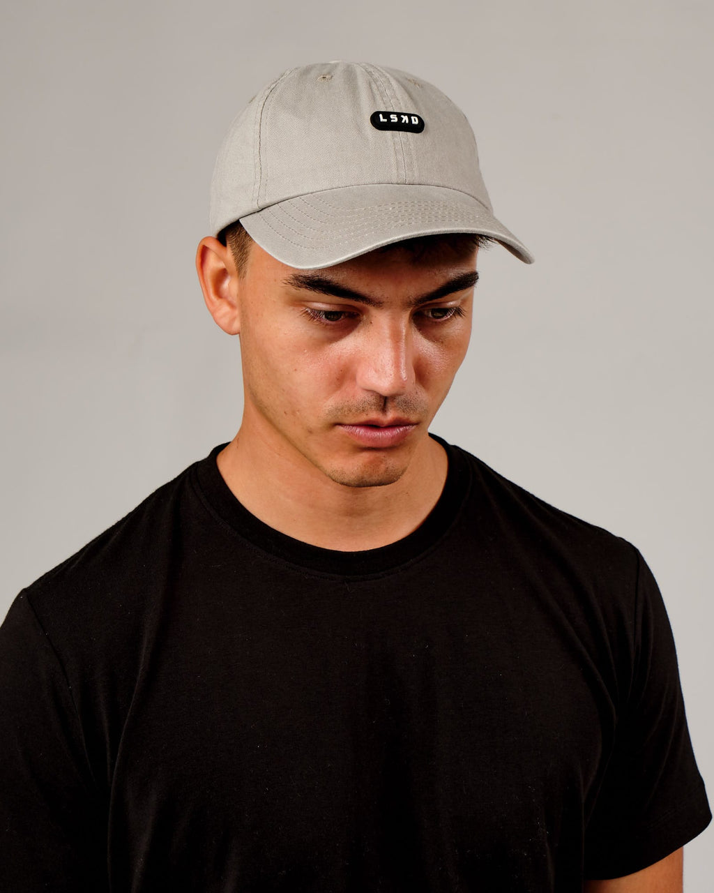 Model wearing Capsule Cap - Bone