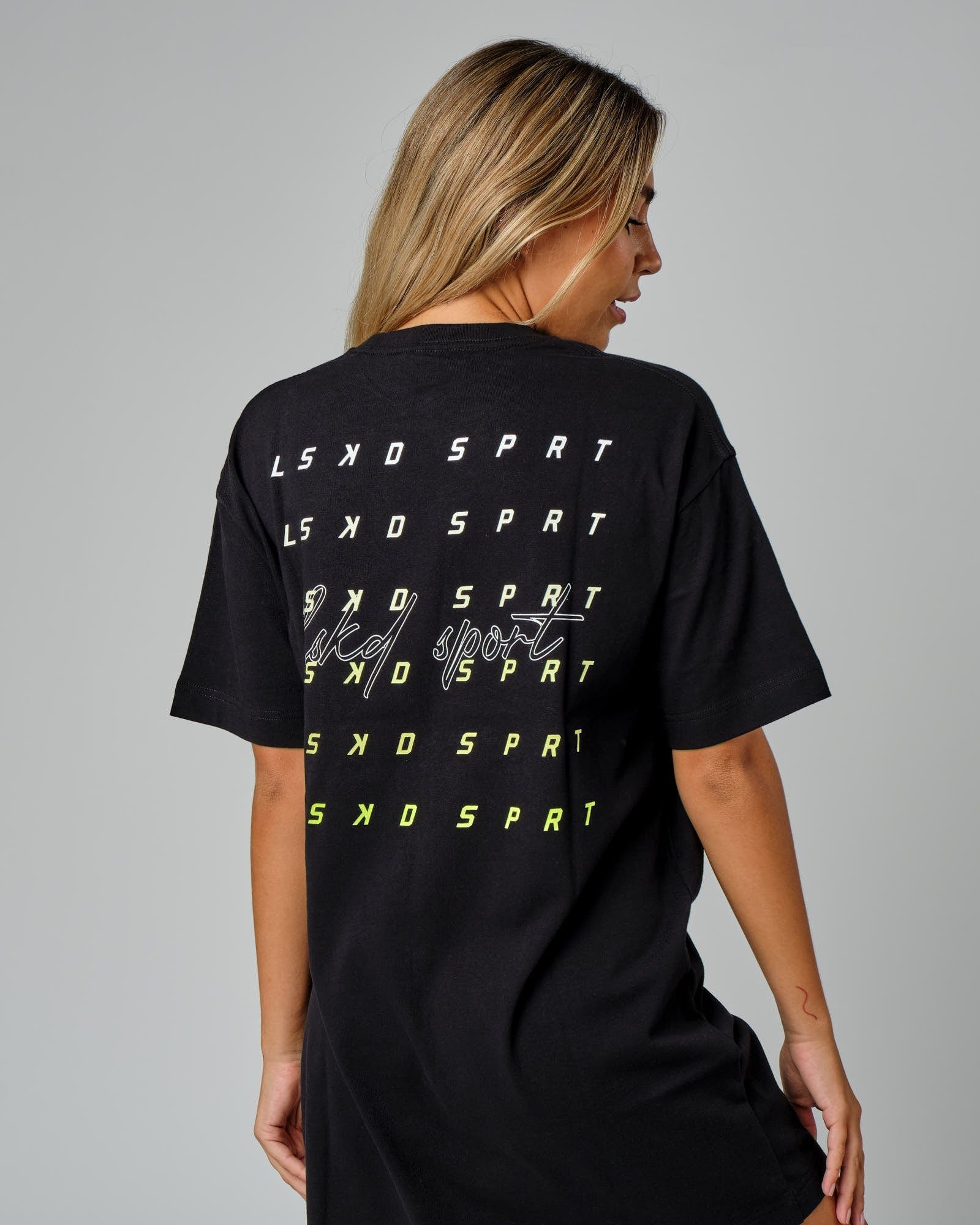 Model wearing Fixed Tee Dress - Black-Fluro Lime
