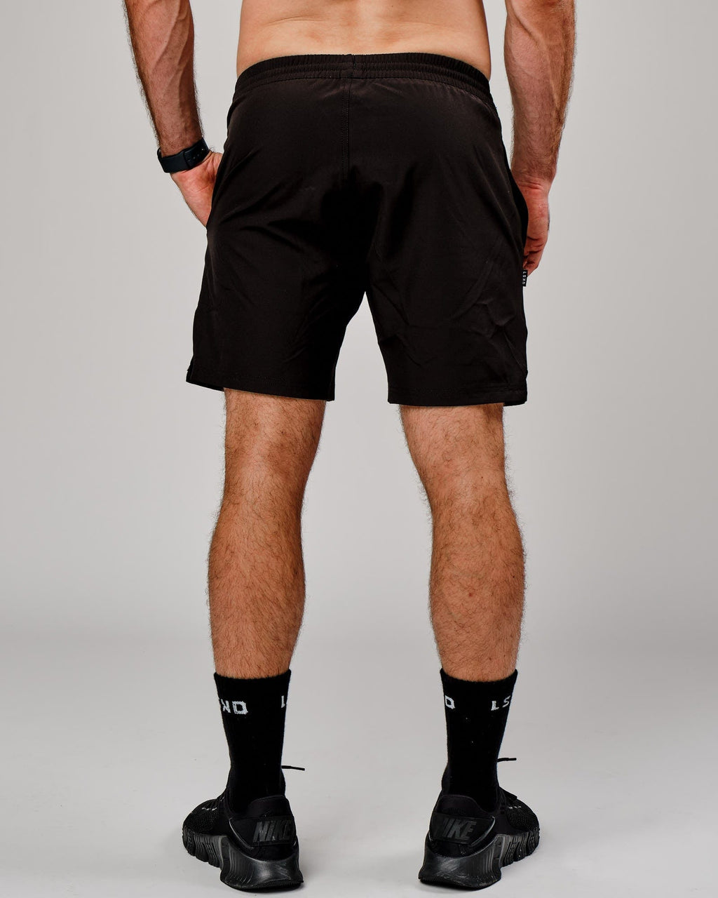 Model wearing Capsule 7" Performance Short - Black