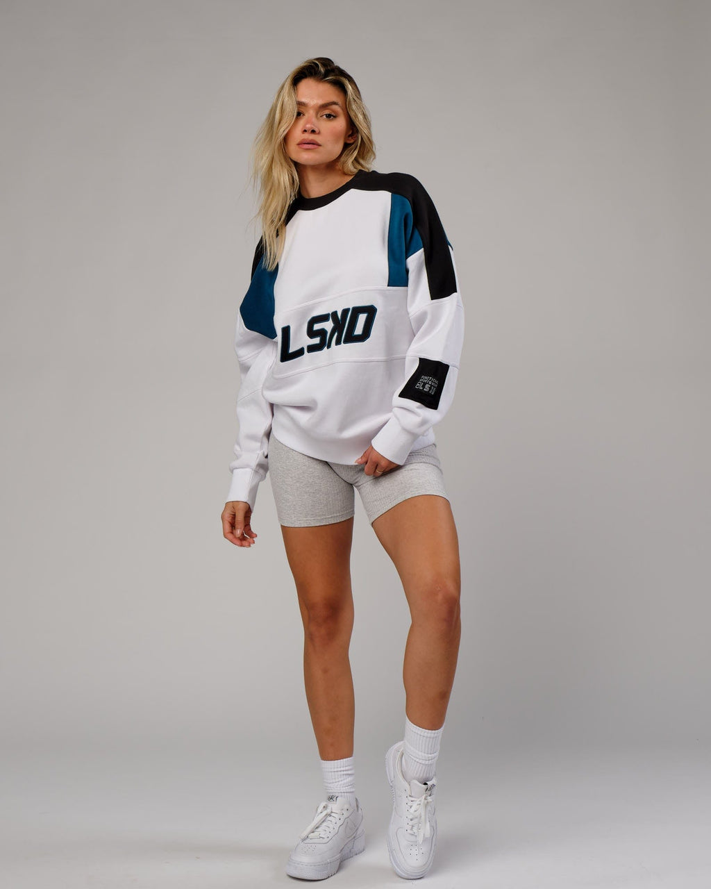 Model wearing Unisex Slam Sweater Oversize - White-Atlantic