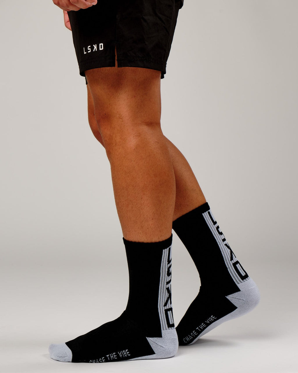 Model wearing Swish Crew Performance Sock - Black-White