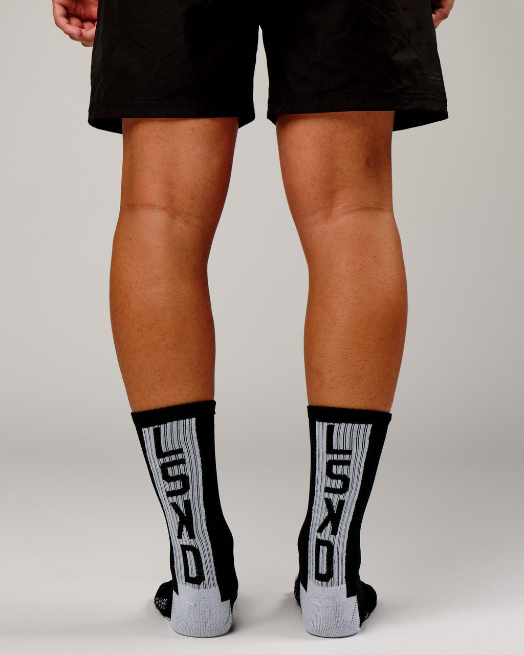 Model wearing Swish Crew Performance Sock - Black-White