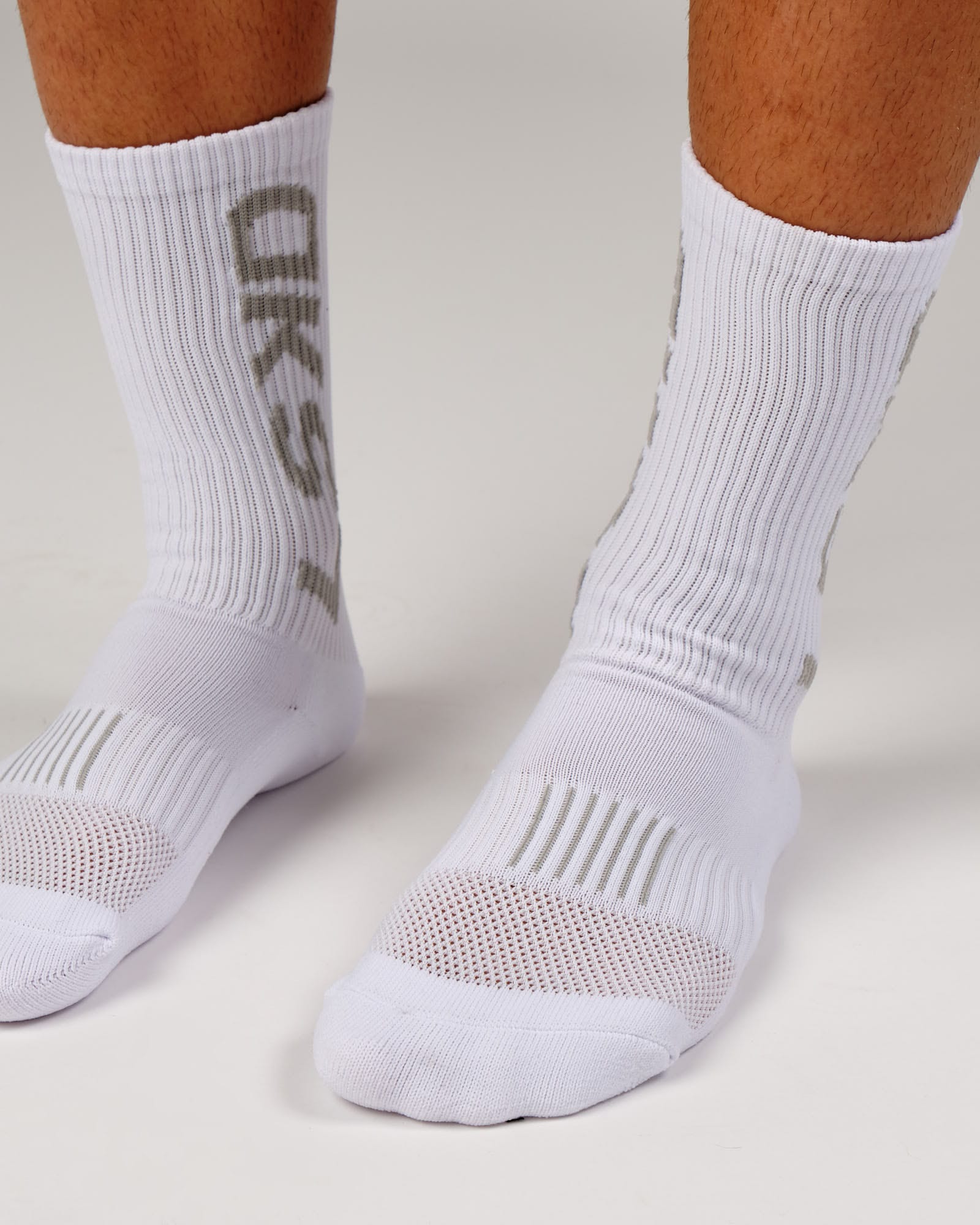 Model wearing Fleet Crew Performance Sock - White