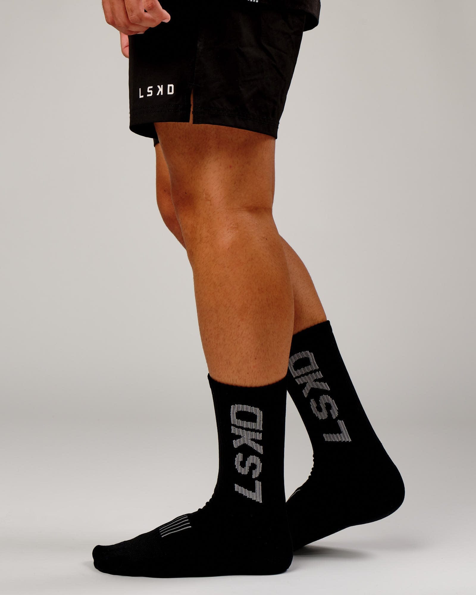 Model wearing Fleet Crew Performance Sock - Black