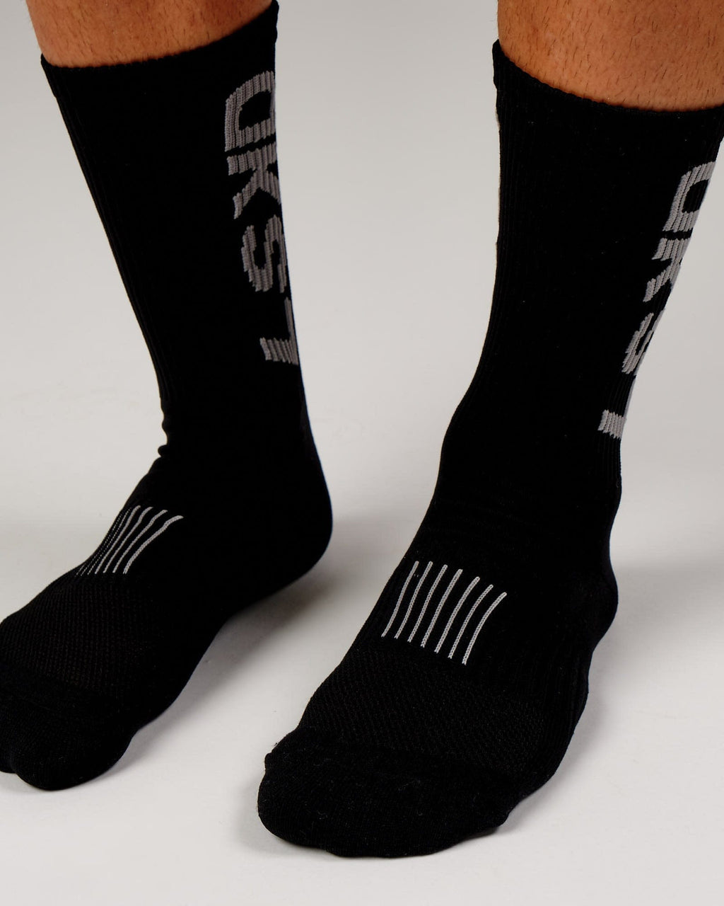 Model wearing Fleet Crew Performance Sock - Black