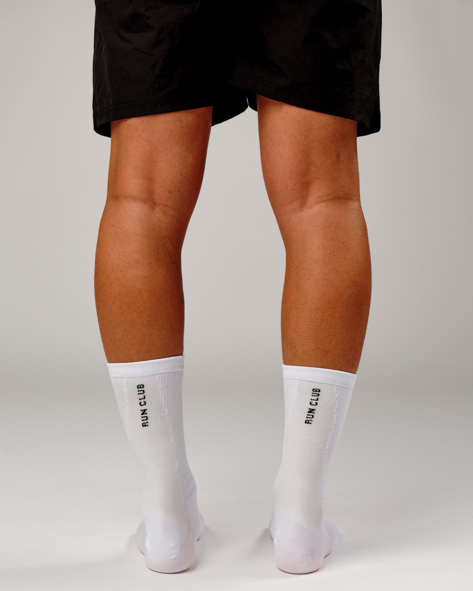 Model wearing Run Club Performance Crew Sock - White-Reflective