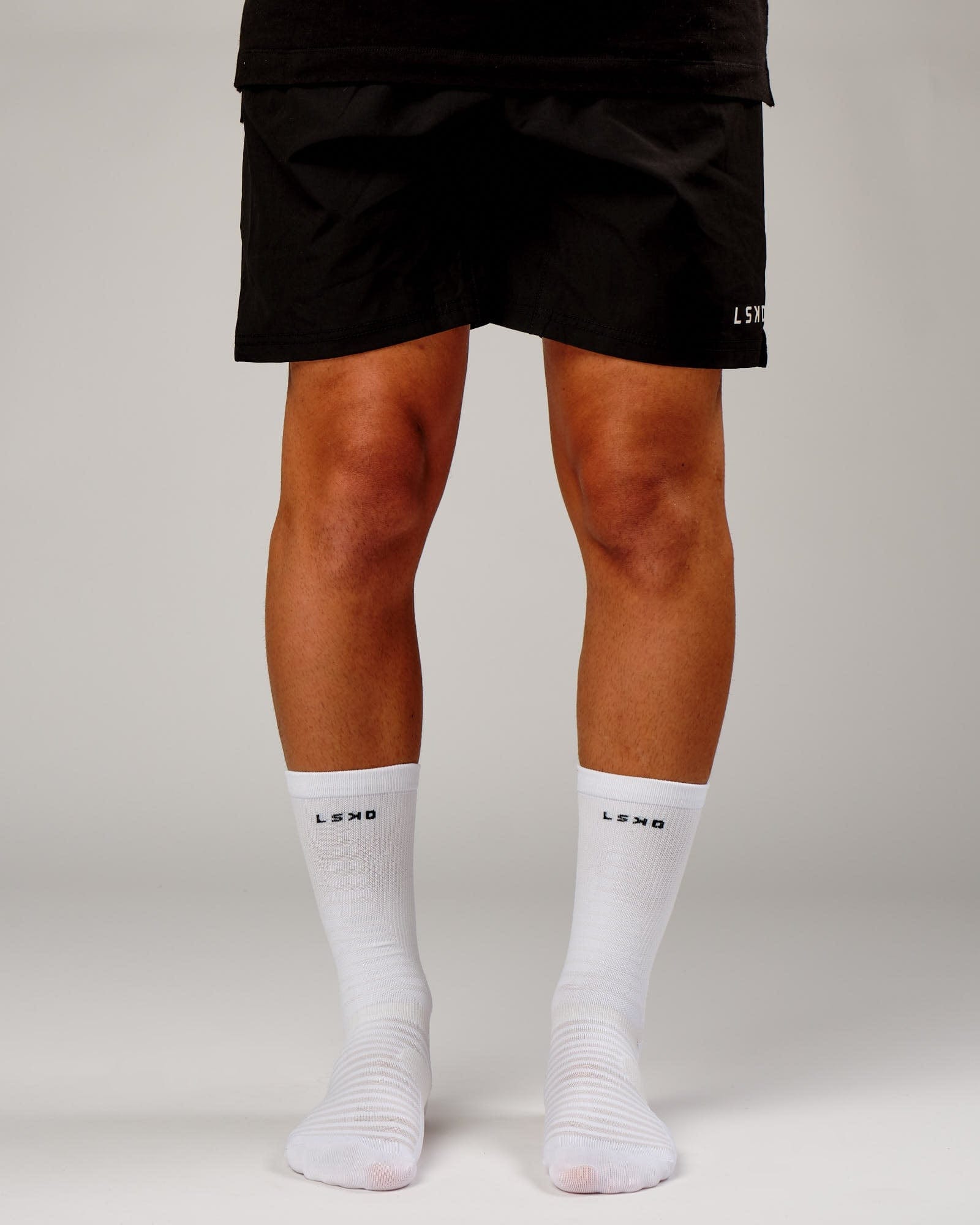 Model wearing Run Club Performance Crew Sock - White-Reflective