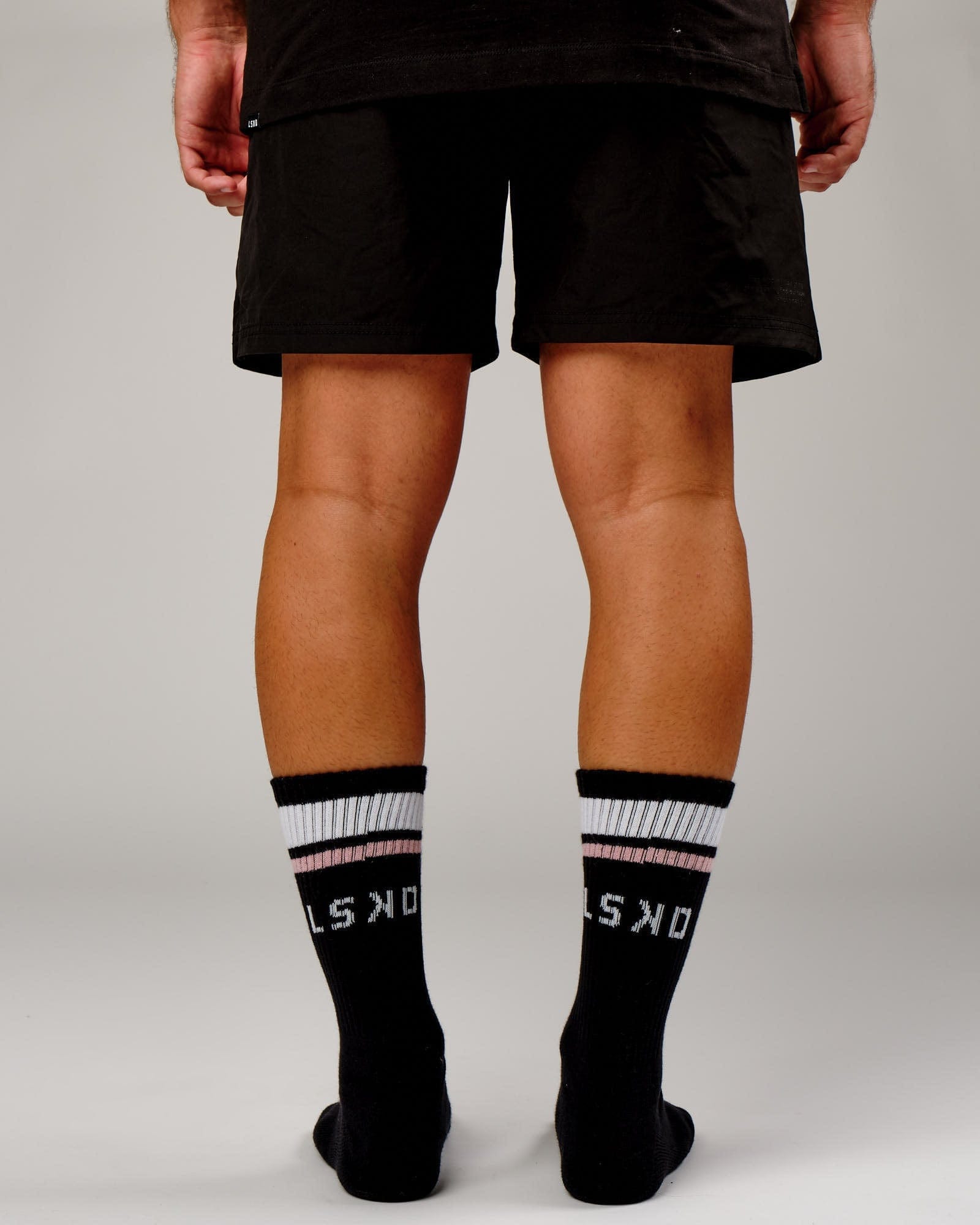 Model wearing Chiller Crew Sock - Black-Dusty Pink