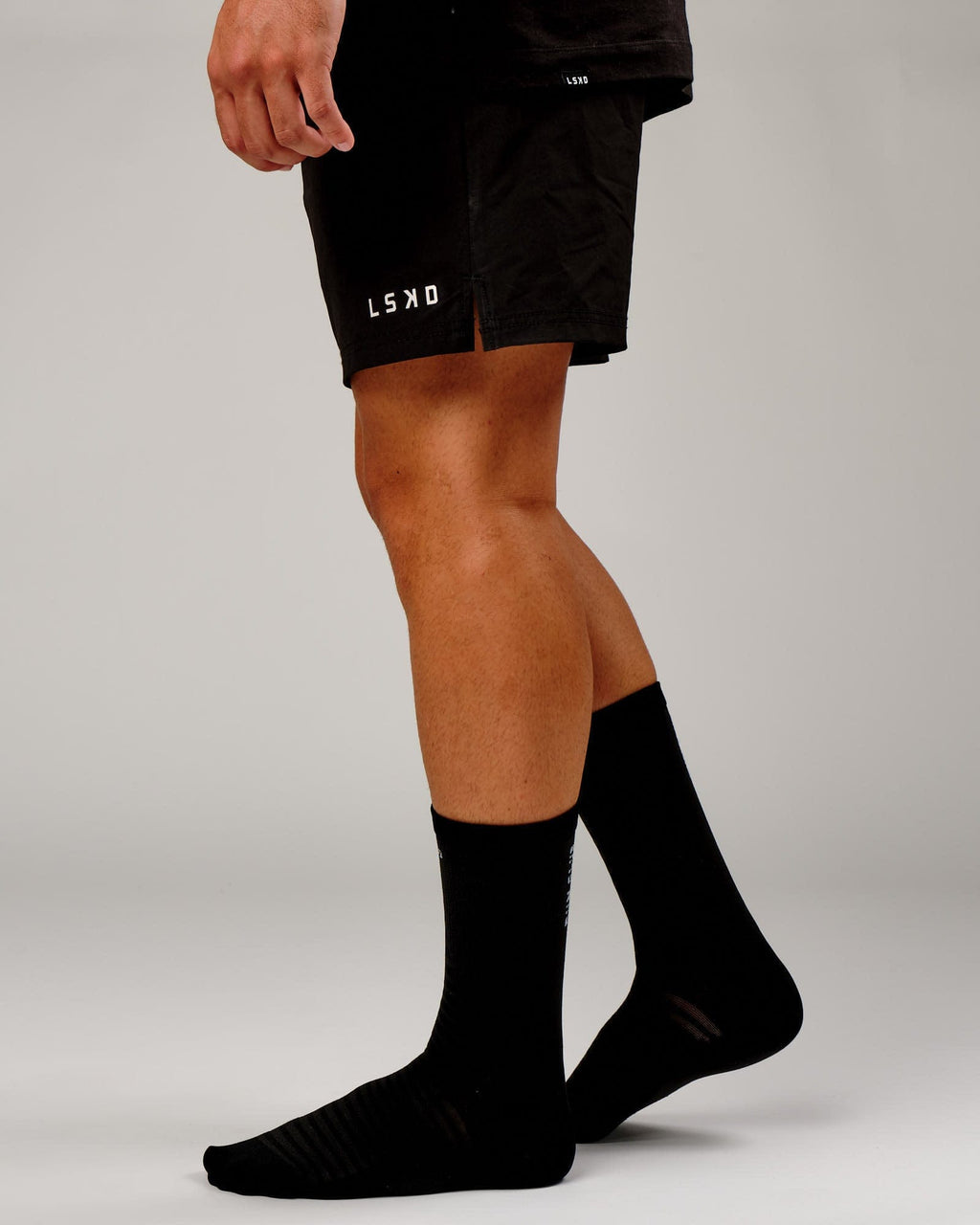 Model wearing Run Club Performance Crew Sock - Black-Reflective