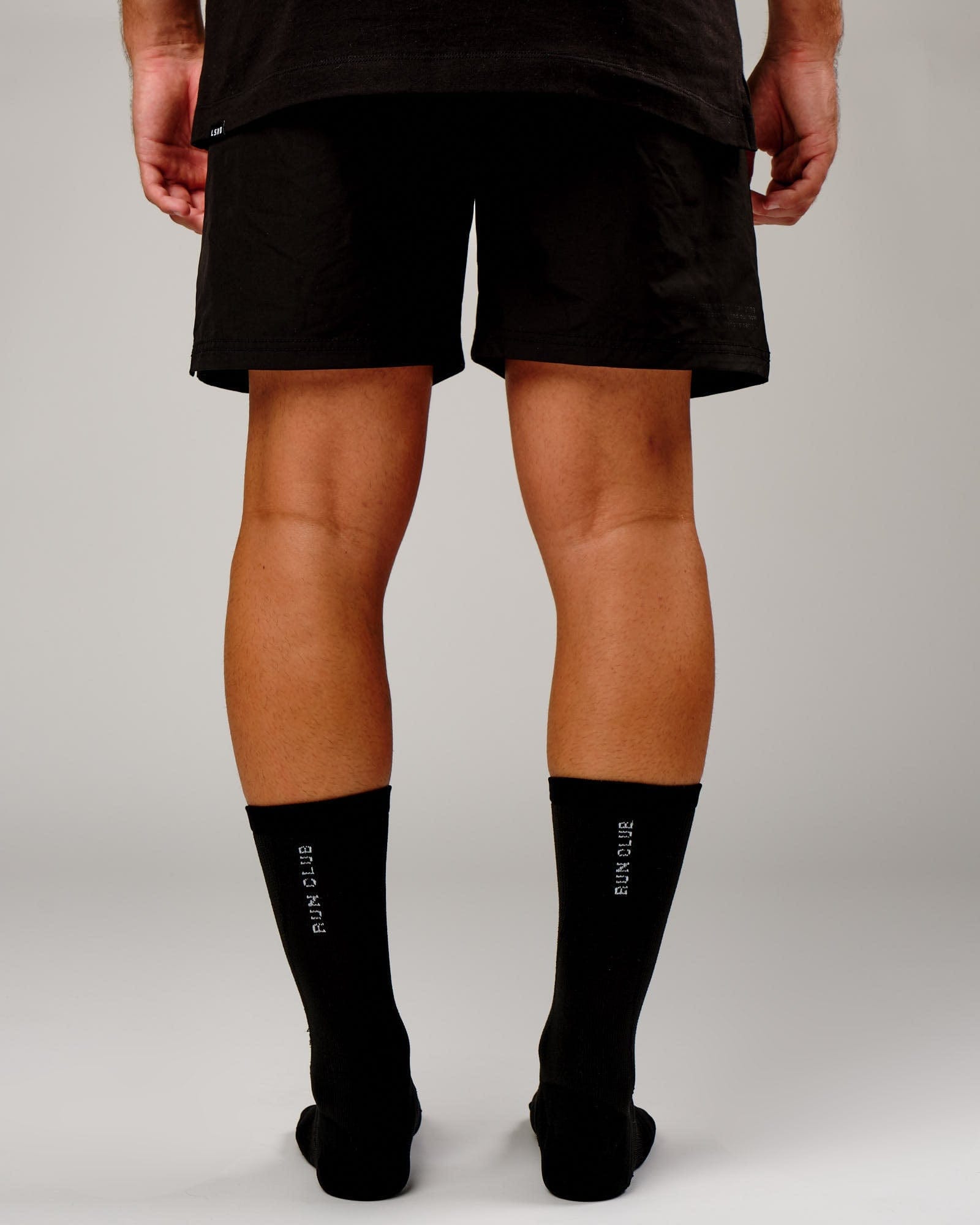 Model wearing Run Club Performance Crew Sock - Black-Reflective