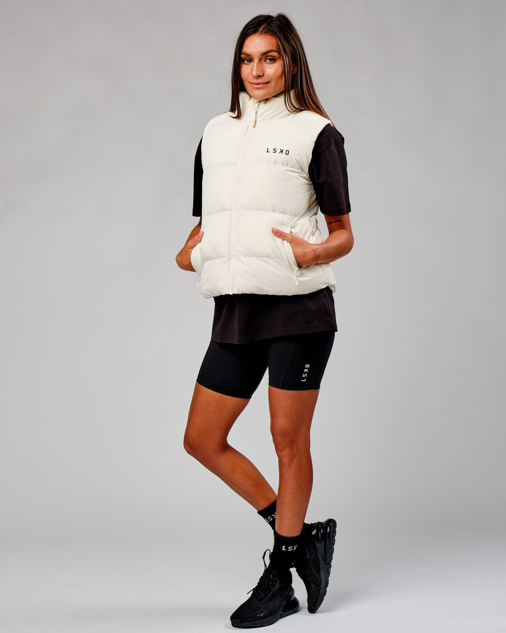 Model wearing Essential Puffer Vest - Cream