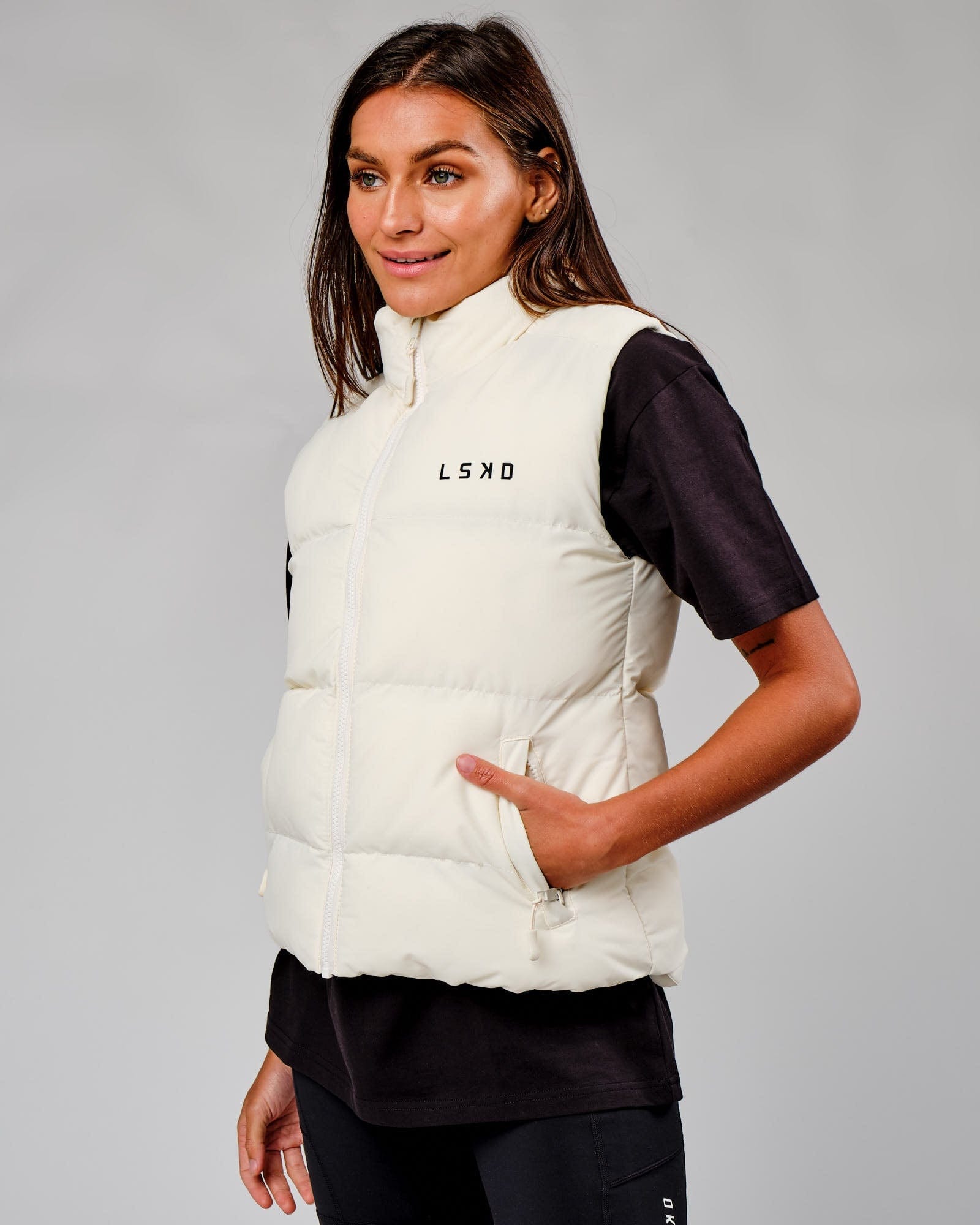 Model wearing Essential Puffer Vest - Cream