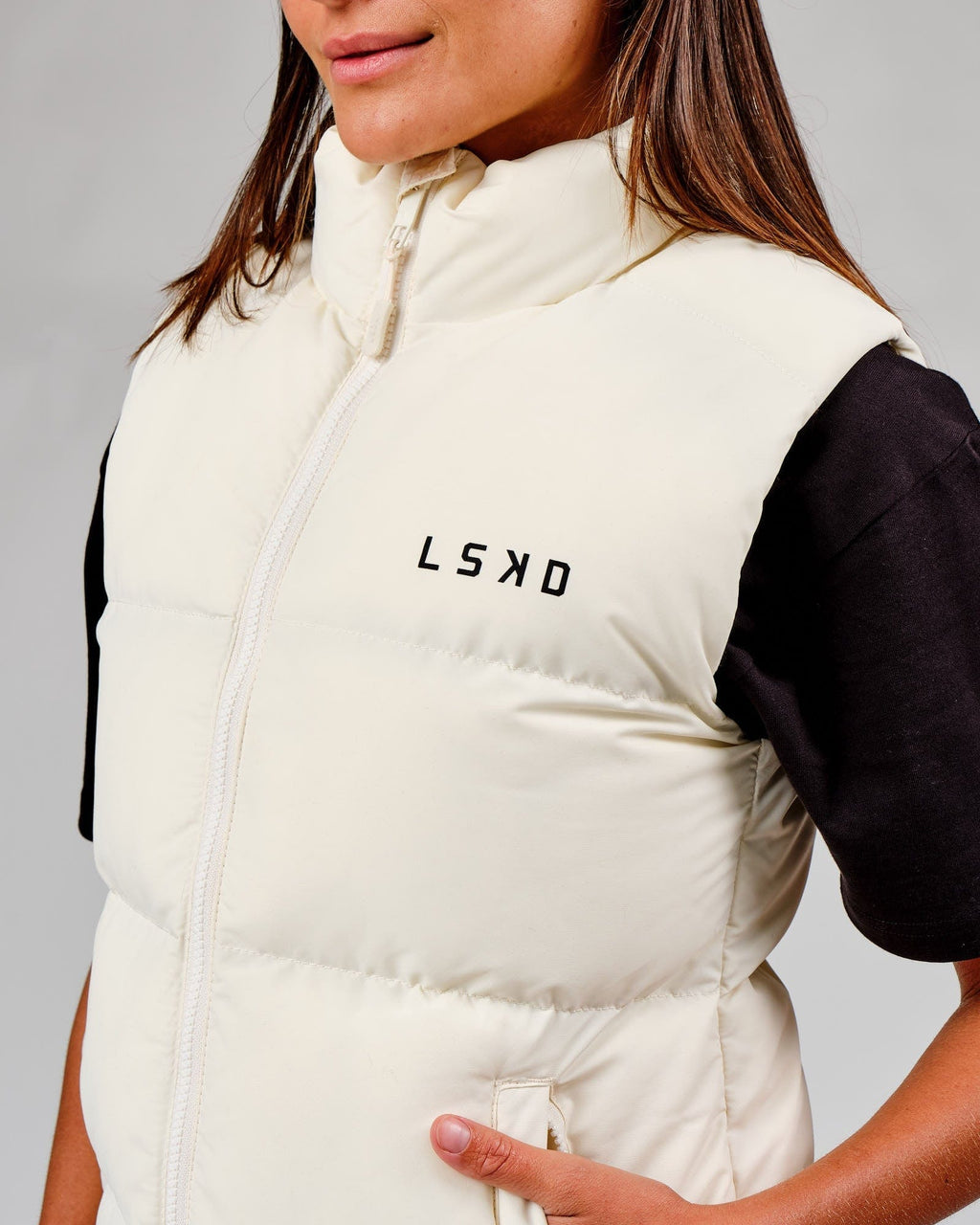 Model wearing Essential Puffer Vest - Cream