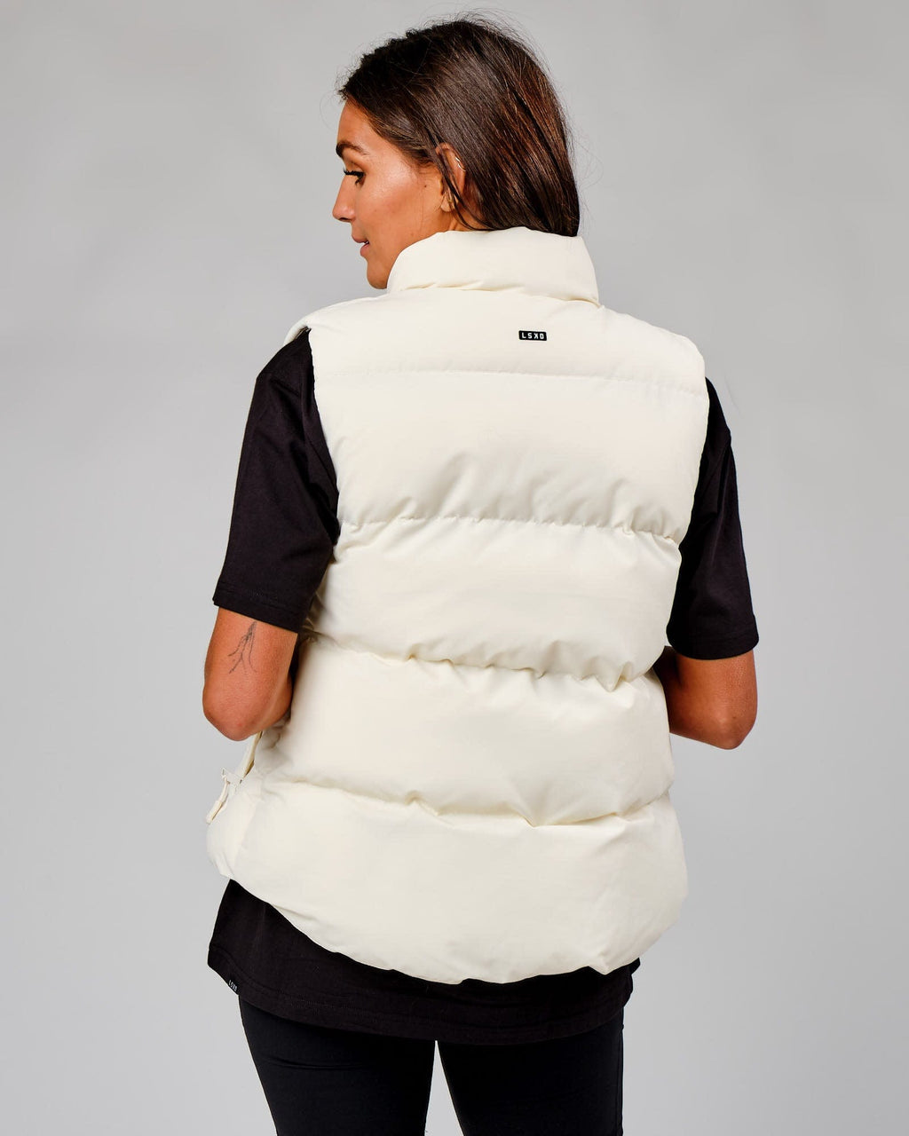 Model wearing Essential Puffer Vest - Cream