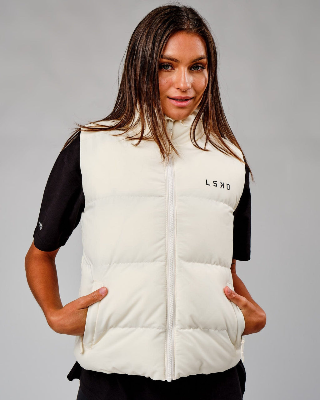 Model wearing Essential Puffer Vest - Cream