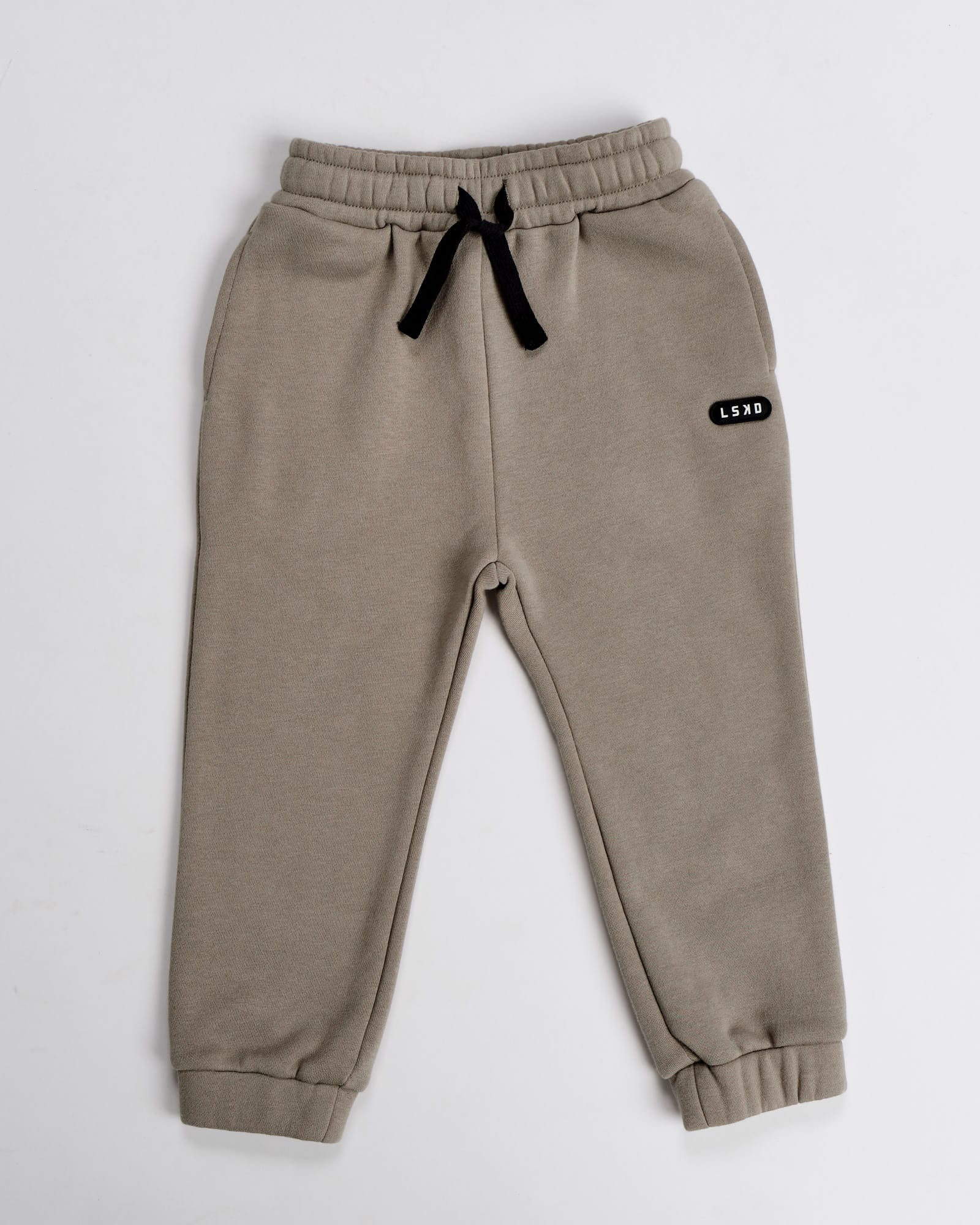Model wearing Capsule Track Pant (00-8) - Laurel Oak