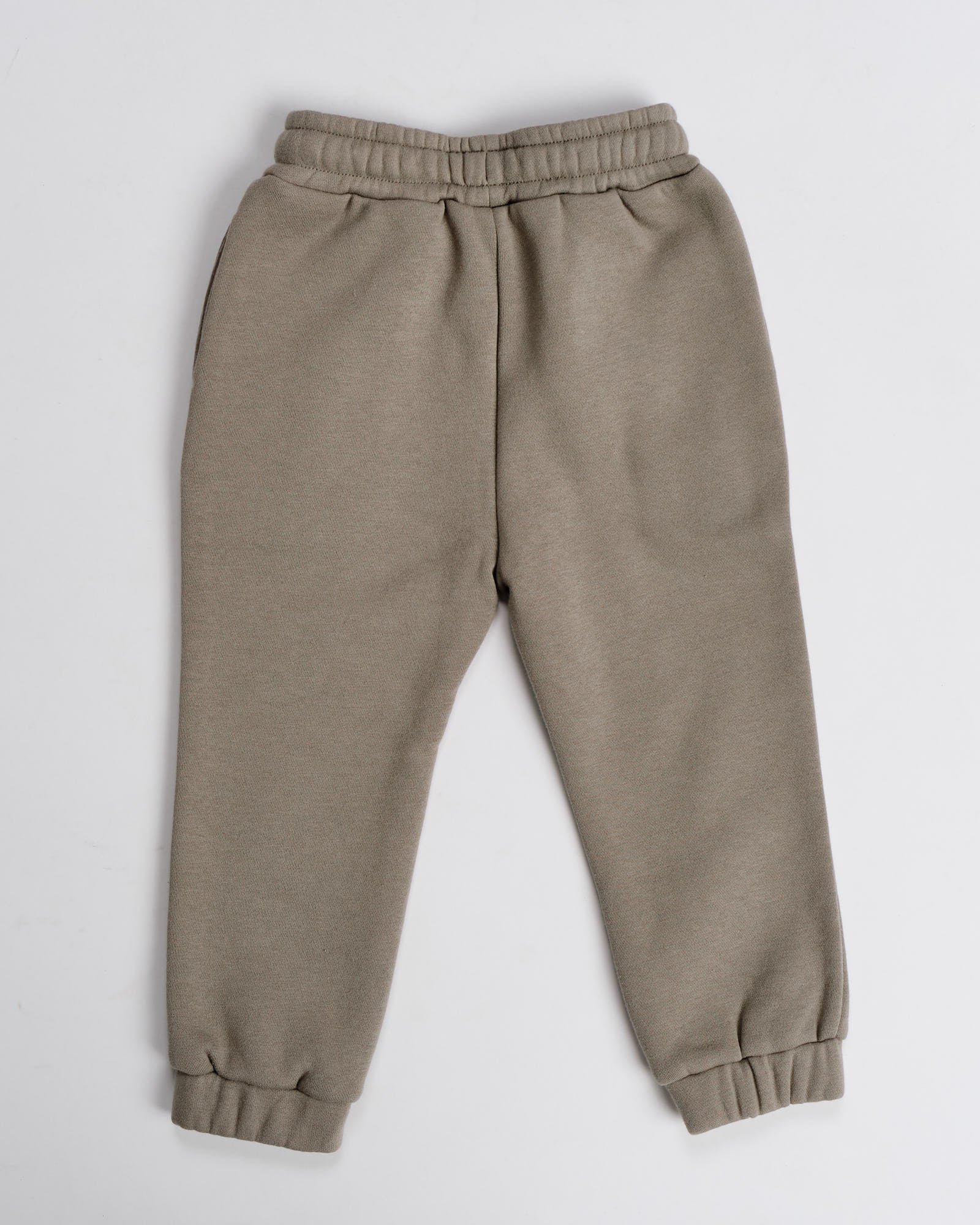 Model wearing Capsule Track Pant (00-8) - Laurel Oak