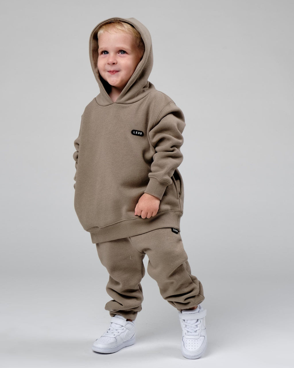 Model wearing Capsule Track Pant (00-8) - Laurel Oak