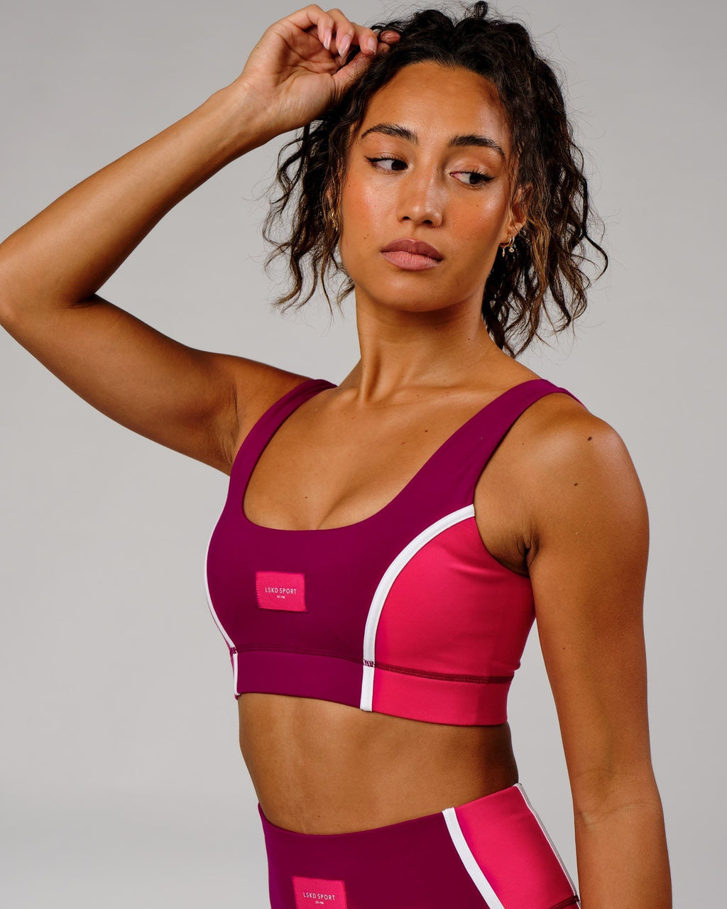 Model wearing Hunter Sports Bra - Candy Apple-Boysenberry
