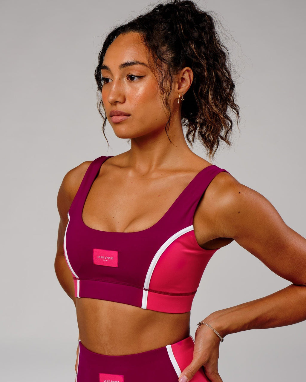 Model wearing Hunter Sports Bra - Candy Apple-Boysenberry