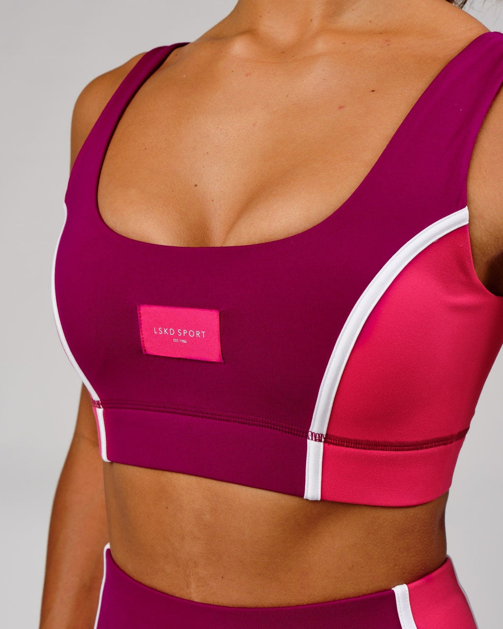 Model wearing Hunter Sports Bra - Candy Apple-Boysenberry