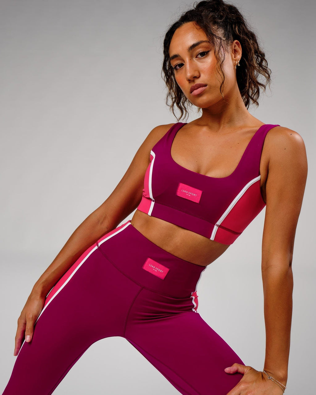 Model wearing Hunter Sports Bra - Candy Apple-Boysenberry