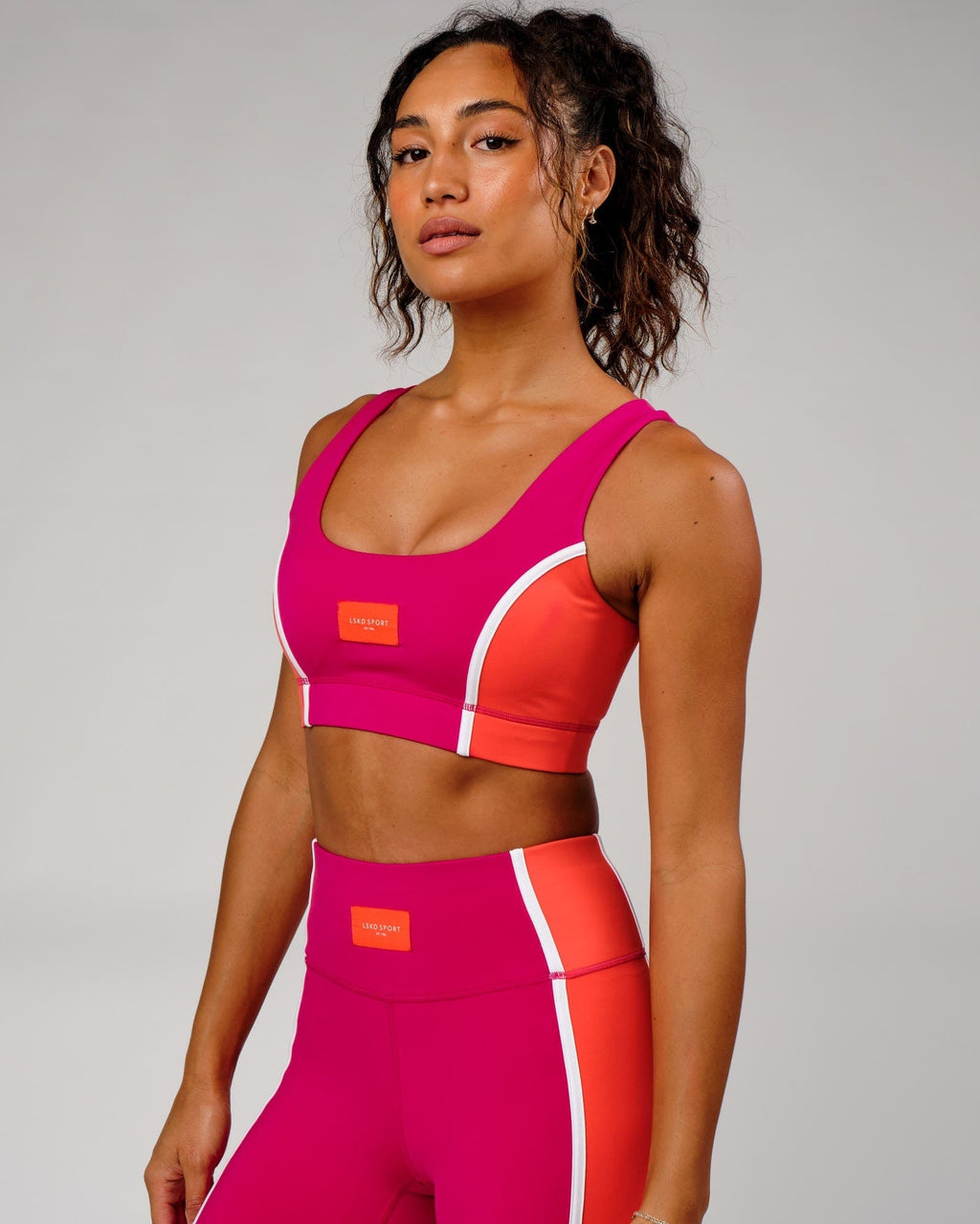 Model wearing Hunter Sports Bra - Boysenberry-Fruit Punch