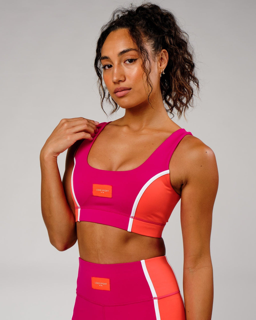 Model wearing Hunter Sports Bra - Boysenberry-Fruit Punch