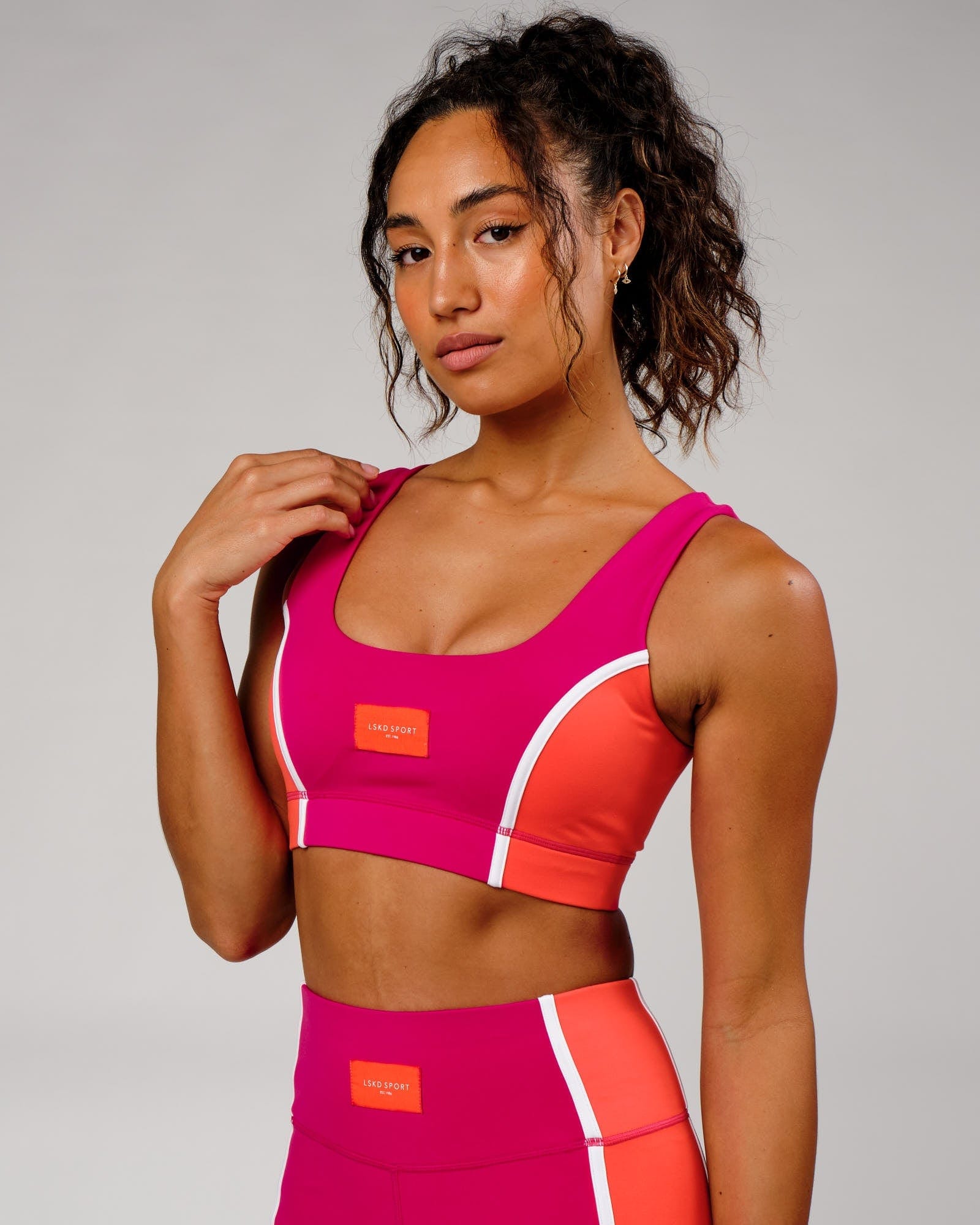 Model wearing Hunter Sports Bra - Boysenberry-Fruit Punch