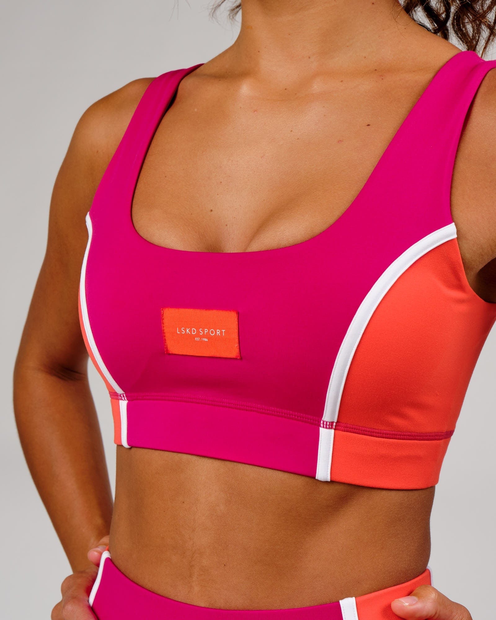 Model wearing Hunter Sports Bra - Boysenberry-Fruit Punch